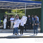 Arrests of two people who held up protest placards at the Athens parade