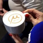 A cafe in Thessaloniki serves cappuccino with the metro logo