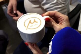 A cafe in Thessaloniki serves cappuccino with the metro logo